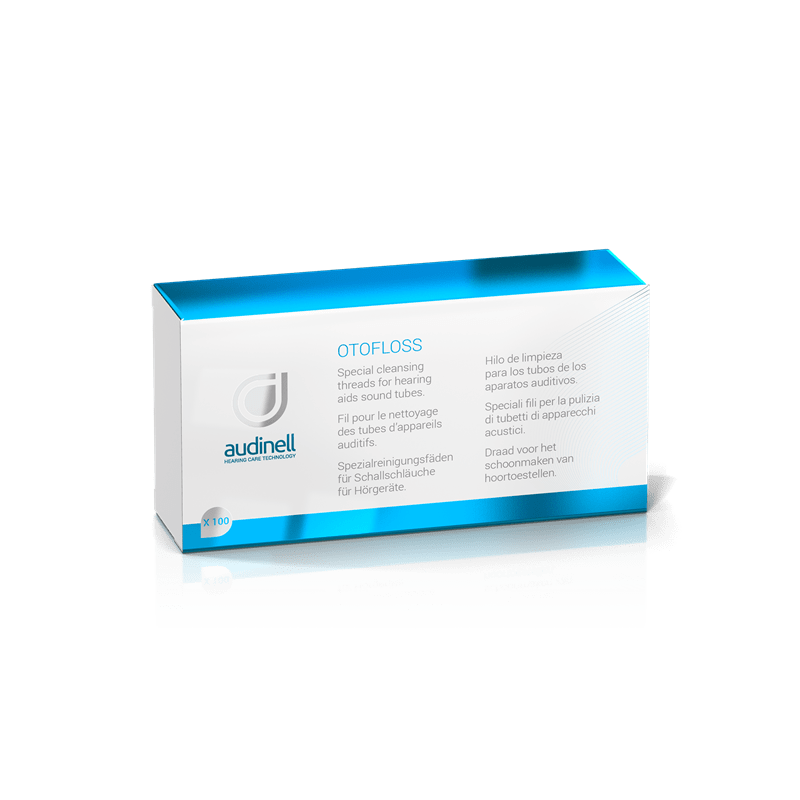 A blue and white Otofloss box by audinell containing special cleaning threads for hearing aid sound tubes, with multilingual product information on the front.