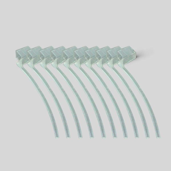 Eight clear plastic cable ties for Concha Lock installations are neatly arranged in a slightly fanned-out row on a plain light gray background.