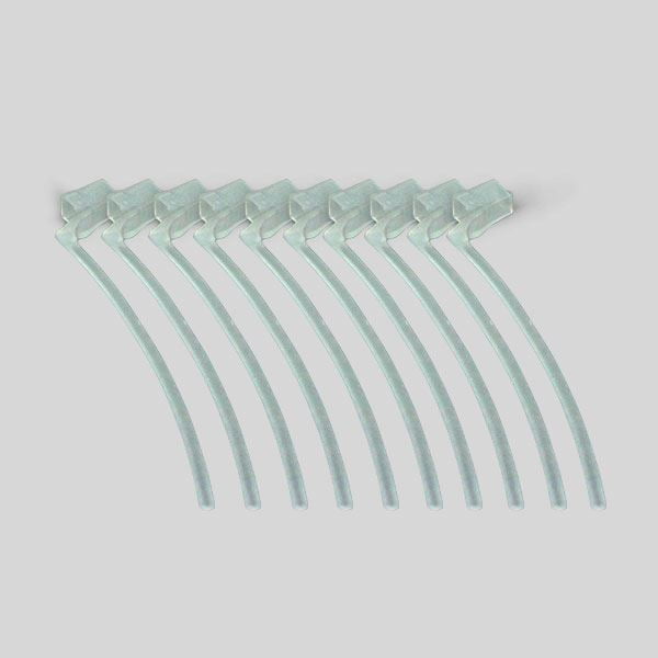 Eight Concha Lock transparent plastic cable ties are neatly arranged in a slightly curved row on a plain light gray background.